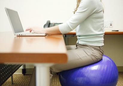 woman-exercise-ball-work-office-440x310_0